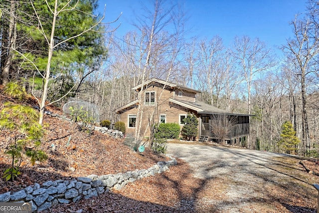 view of side of property with driveway