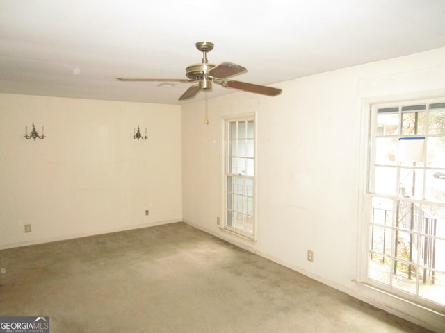 carpeted empty room with ceiling fan