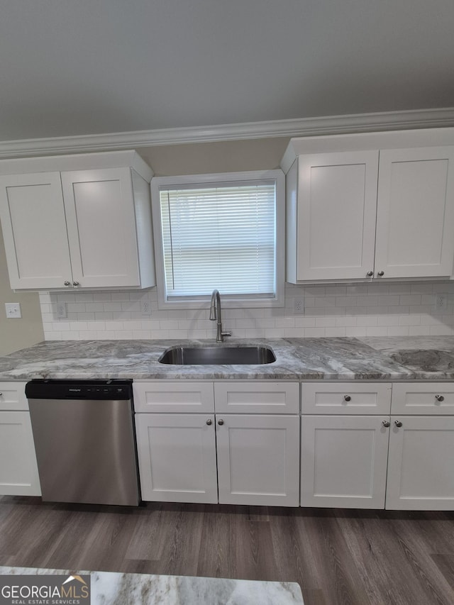 kitchen featuring crown molding, dishwasher, a sink, and white cabinetry