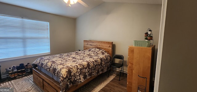 bedroom with lofted ceiling, hardwood / wood-style flooring, and ceiling fan