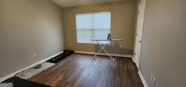 spare room with dark hardwood / wood-style flooring