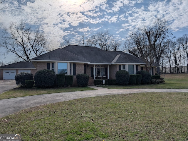 single story home with a front lawn and a garage