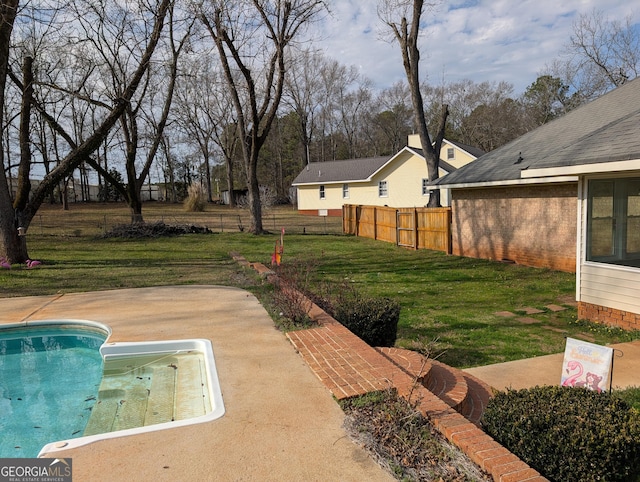 view of yard with a patio area and a fenced in pool