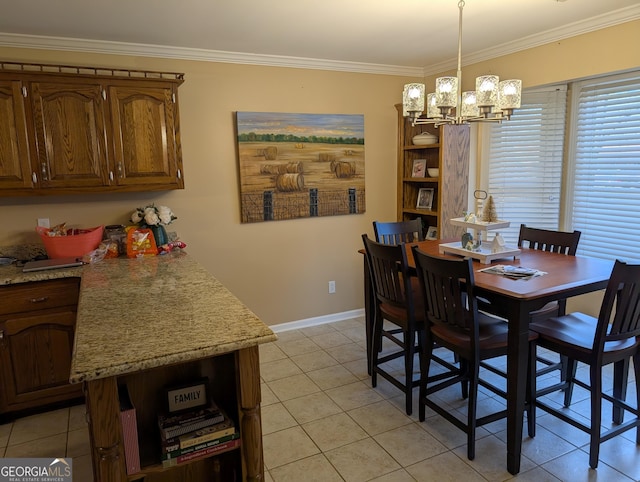 tiled dining space featuring ornamental molding and a chandelier