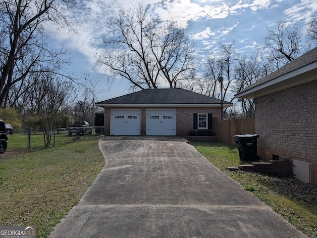 exterior space featuring a front lawn and a garage