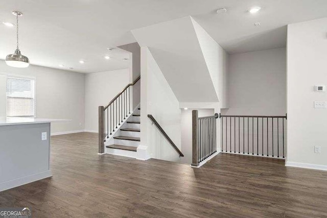 stairway featuring wood-type flooring