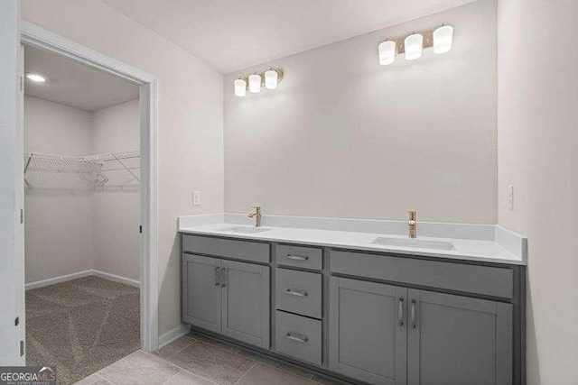 bathroom with vanity and tile patterned flooring