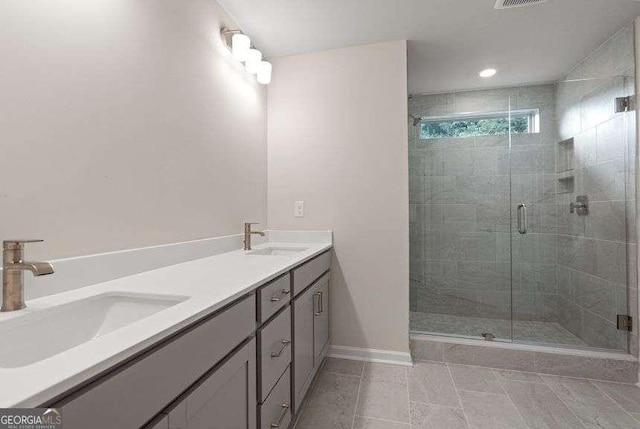 bathroom featuring vanity and a shower with shower door