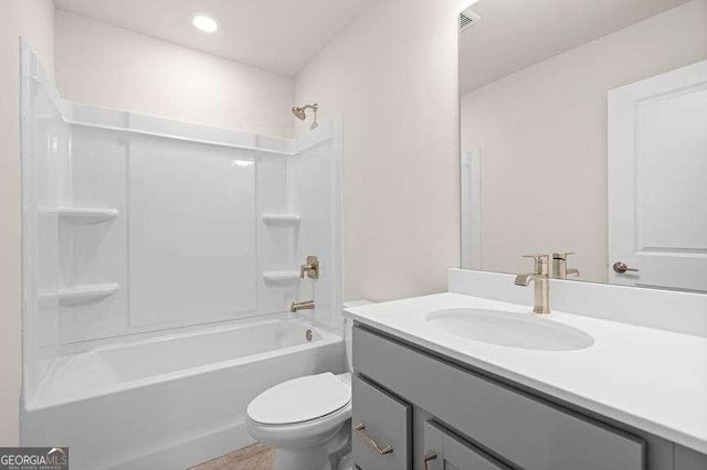 full bathroom with shower / tub combination, vanity, and toilet