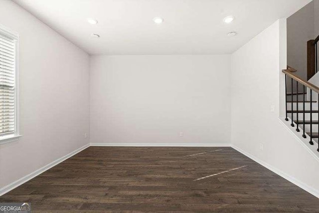 empty room featuring dark hardwood / wood-style flooring