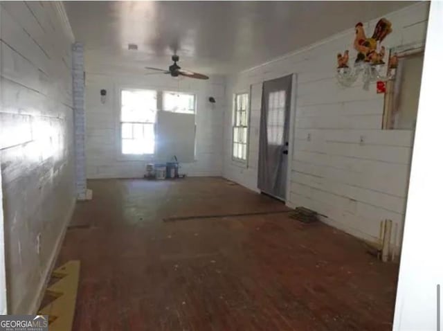 interior space featuring hardwood / wood-style floors and ceiling fan