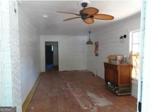 interior space featuring ceiling fan and hardwood / wood-style floors