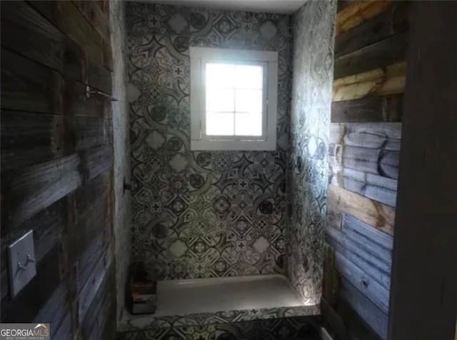 bathroom with a tile shower