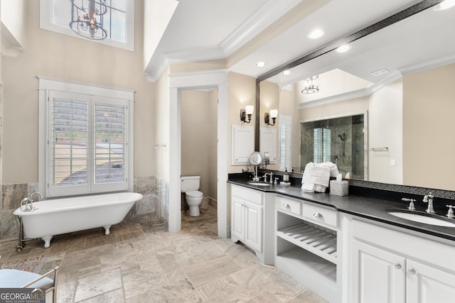 full bathroom featuring toilet, an inviting chandelier, tile walls, ornamental molding, and vanity