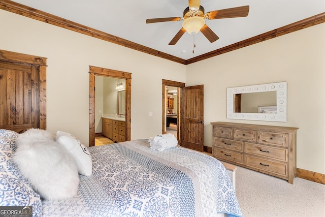 bedroom featuring light carpet, connected bathroom, crown molding, and ceiling fan