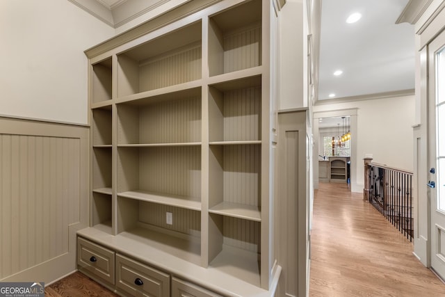 interior details featuring hardwood / wood-style flooring and ornamental molding