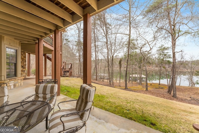 view of patio / terrace with a water view