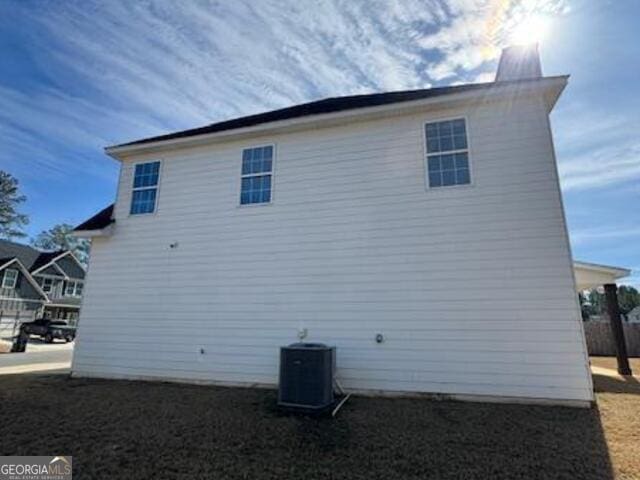 view of property exterior with central air condition unit