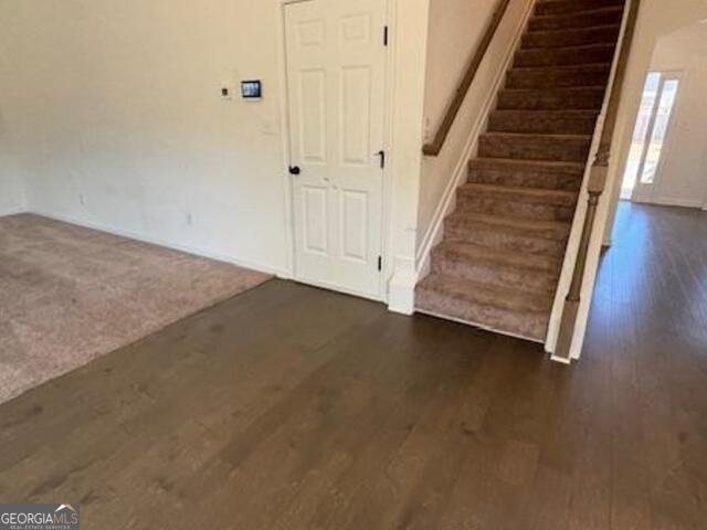 interior space with dark hardwood / wood-style floors