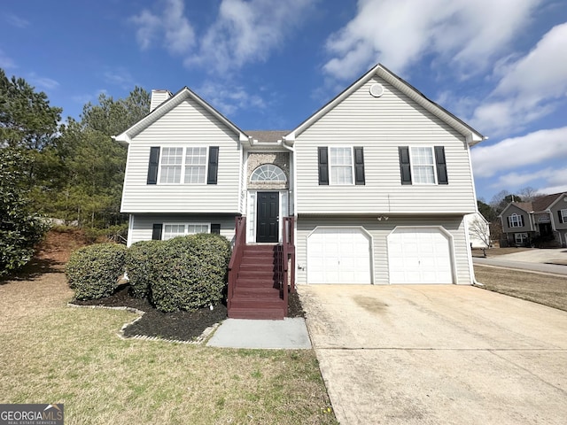 1202 Grove Trail Pass, Douglasville, GA 30134 - split foyer home featuring a garage, driveway, and a chimney