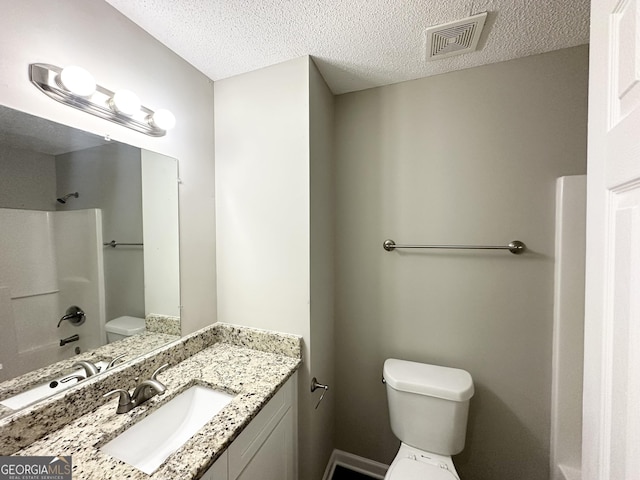 1202 Grove Trail Pass, Douglasville, GA 30134 - bathroom featuring vanity, a textured ceiling, and shower / bathtub combination
