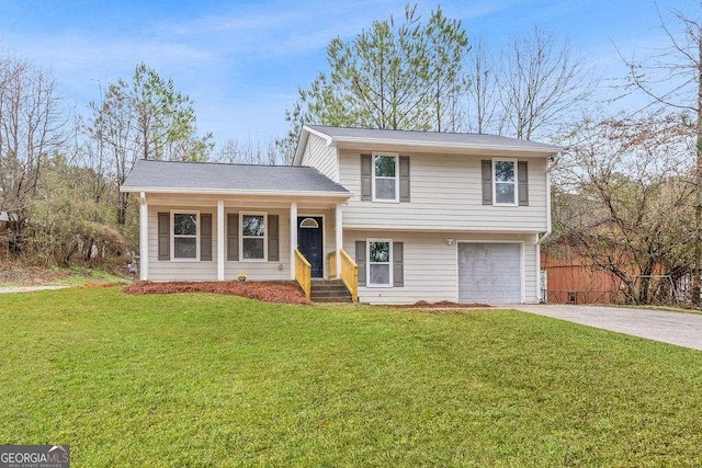 split level home featuring a garage and a front yard