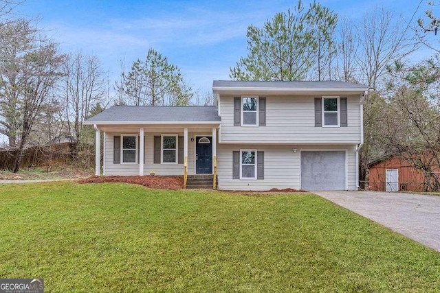 tri-level home featuring a garage and a front lawn