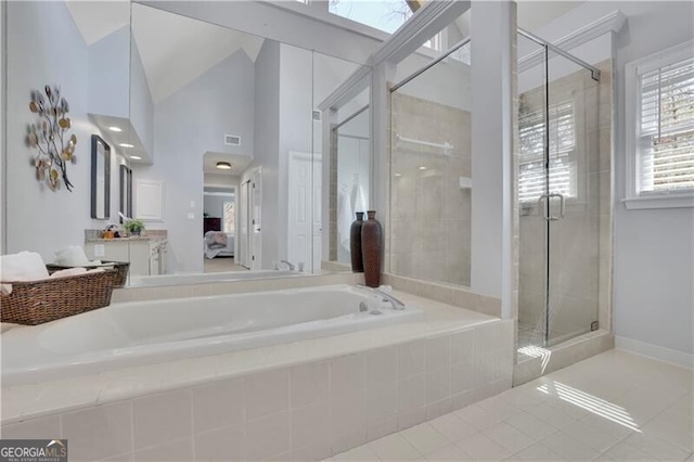 ensuite bathroom with a garden tub, a shower stall, visible vents, and ensuite bathroom