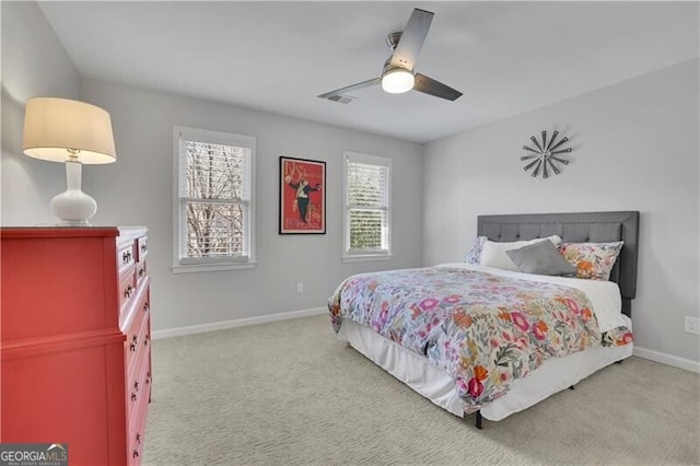 bedroom with carpet, visible vents, baseboards, and a ceiling fan