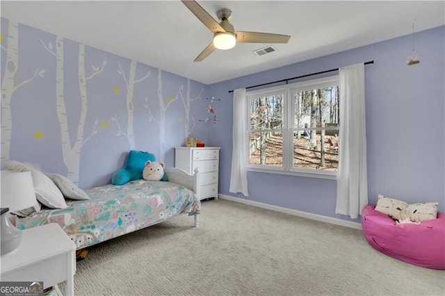 carpeted bedroom with ceiling fan, visible vents, and baseboards