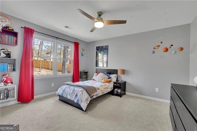 bedroom with a ceiling fan, carpet flooring, visible vents, and baseboards