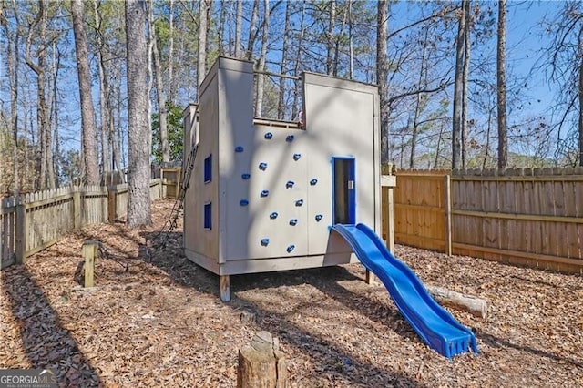 view of play area featuring a fenced backyard