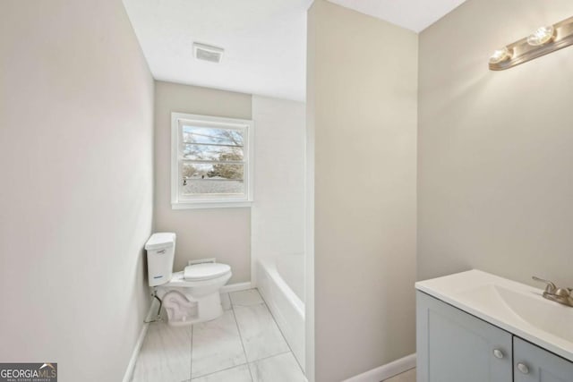 bathroom with vanity and toilet