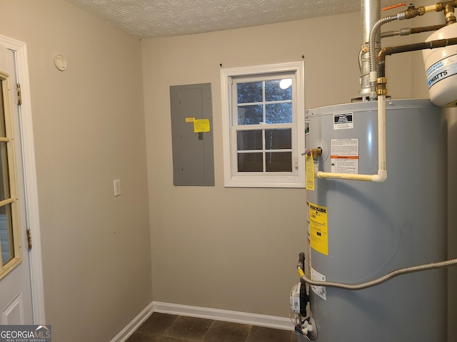 utility room with gas water heater and electric panel