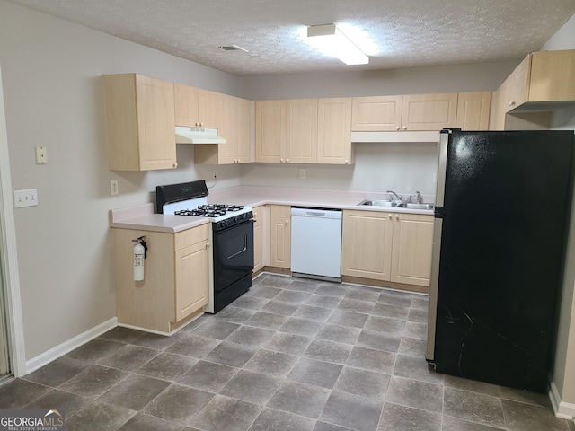 kitchen with stainless steel refrigerator, white dishwasher, black range with gas cooktop, and light brown cabinets