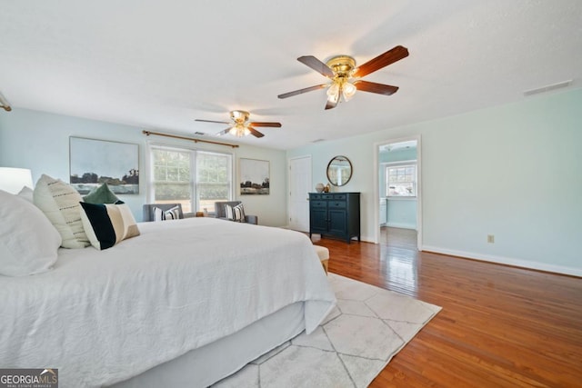 bedroom featuring hardwood / wood-style flooring and ceiling fan