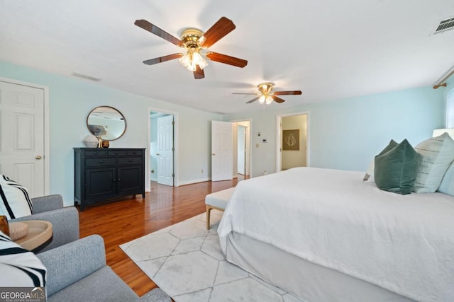 bedroom featuring hardwood / wood-style flooring and ceiling fan