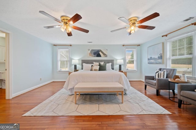 bedroom featuring ceiling fan and hardwood / wood-style floors