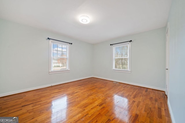 spare room featuring hardwood / wood-style flooring