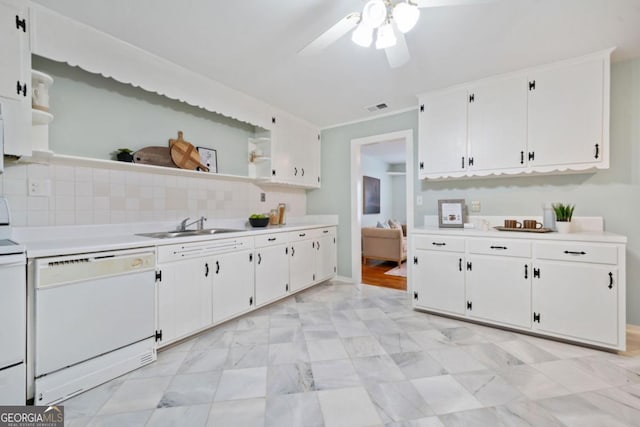 kitchen with sink, white cabinetry, tasteful backsplash, white dishwasher, and ceiling fan