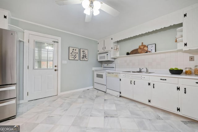 kitchen featuring sink, white cabinets, decorative backsplash, ceiling fan, and white appliances