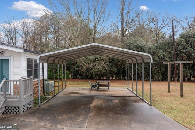 view of car parking with a yard and a carport