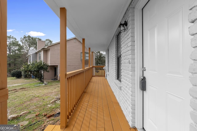 wooden deck featuring covered porch