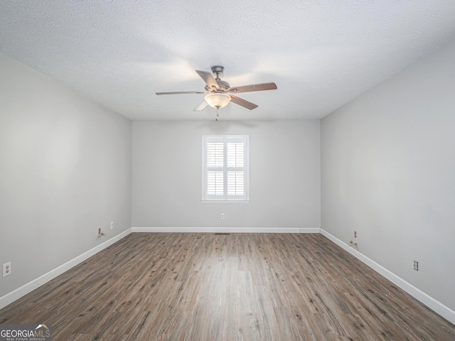 unfurnished room with hardwood / wood-style floors, a textured ceiling, and ceiling fan