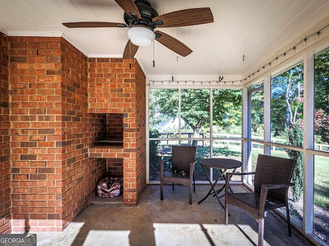 sunroom / solarium with ceiling fan