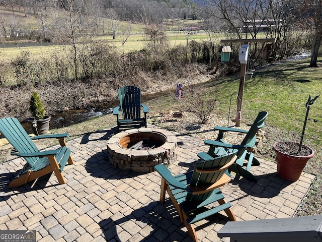 view of patio featuring a fire pit