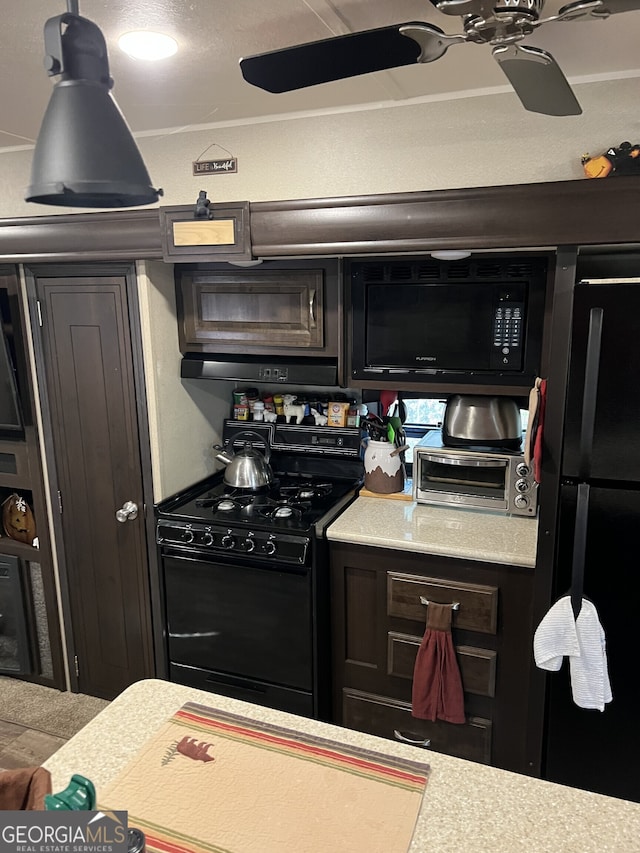 kitchen featuring dark brown cabinetry, black appliances, and ceiling fan