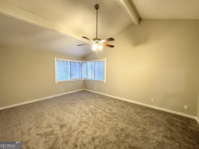 carpeted empty room featuring lofted ceiling with beams and ceiling fan