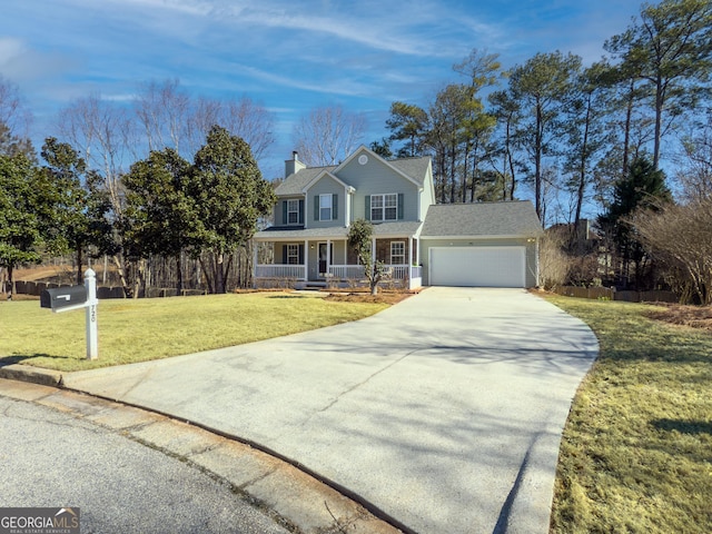 view of front of property featuring a front yard, a garage, and a porch