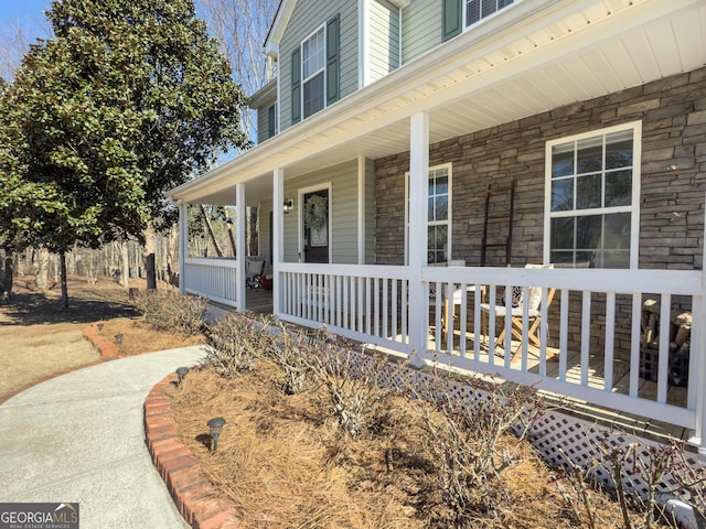 view of exterior entry featuring a porch